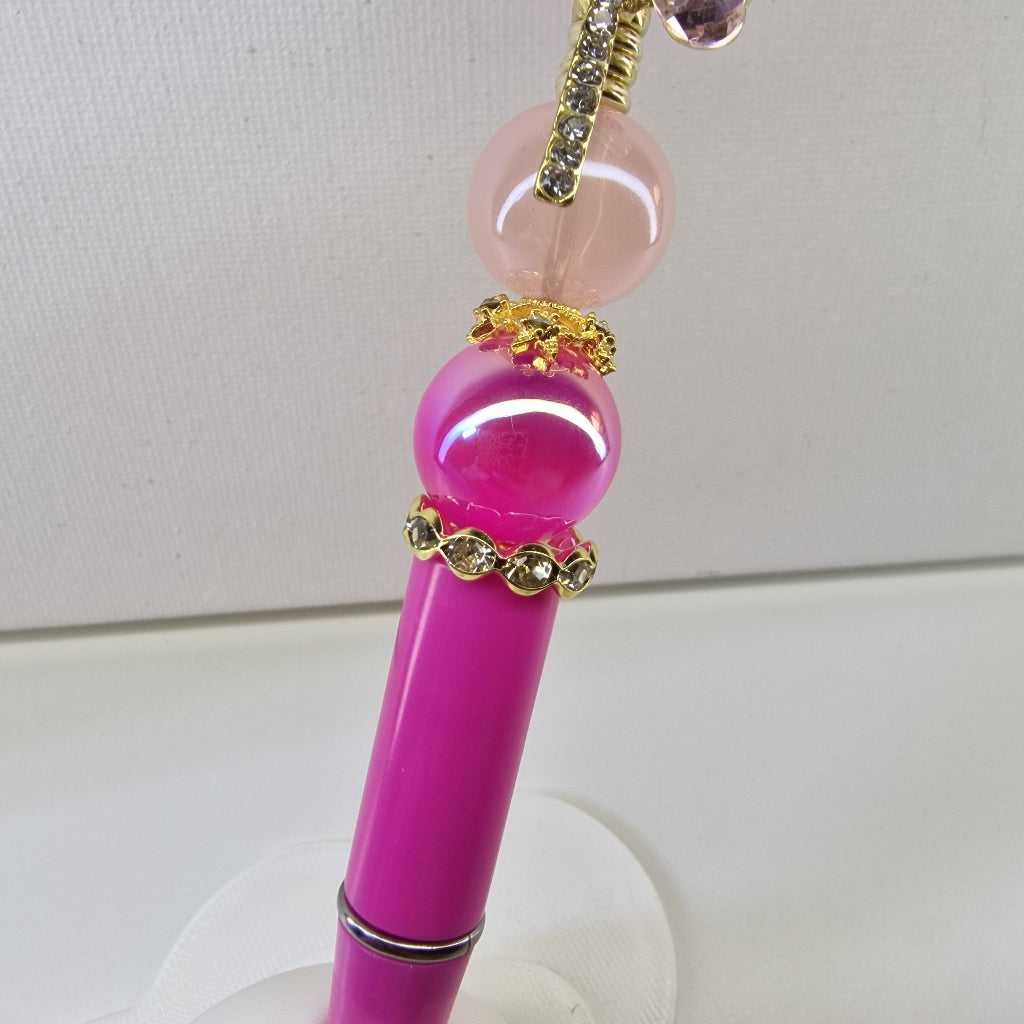 Handversierde roze pen met fuchsiaroze lolly topper